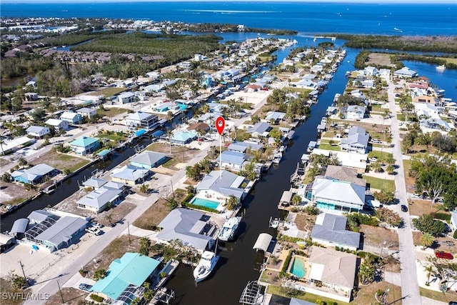 bird's eye view with a water view