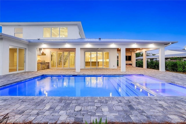 1308 Ridge St, Naples, FL 34103 - outdoor pool featuring an outdoor kitchen, a patio, and a ceiling fan