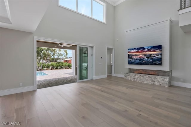 1308 Ridge St, Naples, FL 34103 - entryway featuring a wealth of natural light, wood finished floors, a towering ceiling, and baseboards