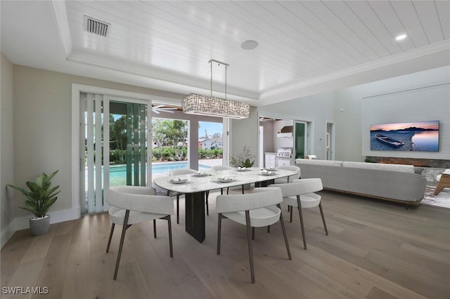 1308 Ridge St, Naples, FL 34103 - dining area featuring a tray ceiling, wooden ceiling, light wood-type flooring, baseboards, and visible vents