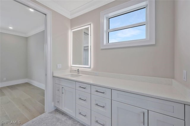 1308 Ridge St, Naples, FL 34103 - bathroom with ornamental molding, vanity, and wood finished floors