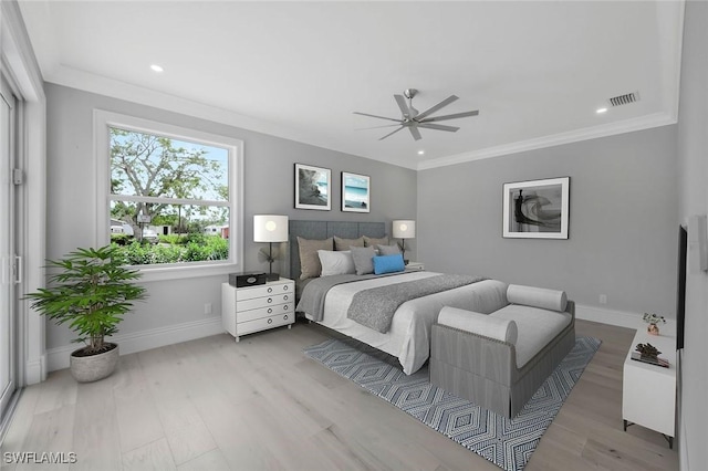 1308 Ridge St, Naples, FL 34103 - bedroom with baseboards, visible vents, ornamental molding, and wood finished floors