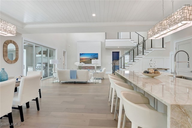 1308 Ridge St, Naples, FL 34103 - dining space featuring ornamental molding, stairway, light wood-style floors, wooden ceiling, and recessed lighting