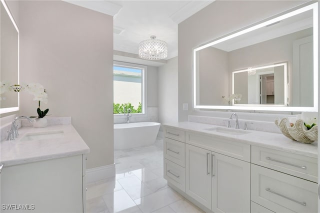 1308 Ridge St, Naples, FL 34103 - bathroom featuring marble finish flooring, two vanities, a chandelier, and a freestanding bath