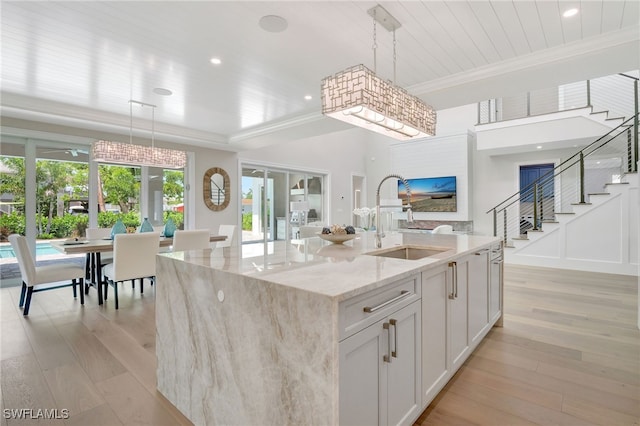 1308 Ridge St, Naples, FL 34103 - kitchen featuring light wood-style floors, light stone counters, decorative light fixtures, crown molding, and recessed lighting