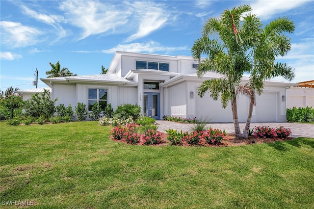 1308 Ridge St, Naples, FL 34103 - view of front of home with driveway, an attached garage, and a front lawn