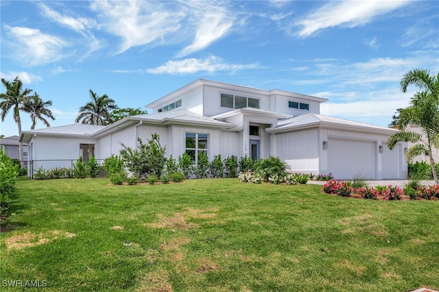 1308 Ridge St, Naples, FL 34103 - prairie-style home with an attached garage, a metal roof, a front lawn, and a standing seam roof
