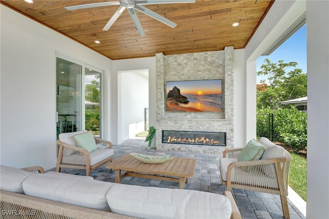 1308 Ridge St, Naples, FL 34103 - view of patio with a ceiling fan and an outdoor living space with a fireplace