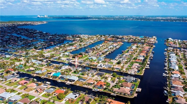 drone / aerial view with a residential view and a water view