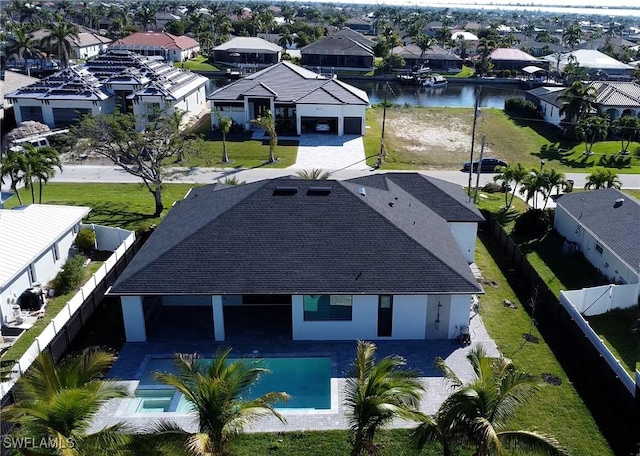 bird's eye view with a residential view and a water view