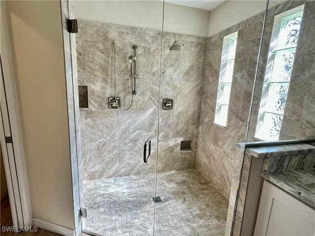 bathroom with a stall shower