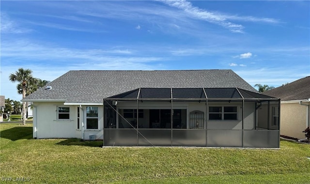 back of house featuring a yard, a shingled roof, glass enclosure, and stucco siding