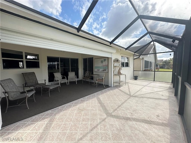 sunroom / solarium featuring vaulted ceiling