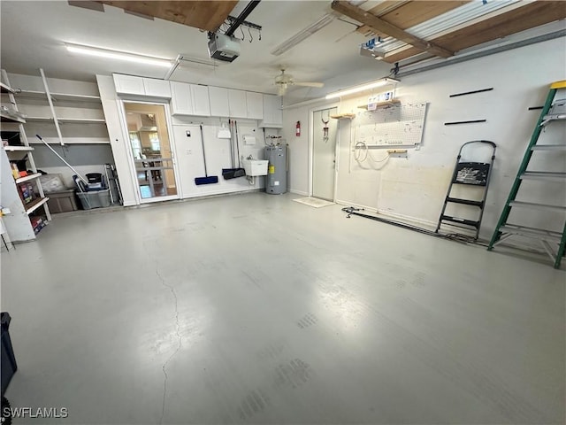 garage featuring water heater, ceiling fan, and a garage door opener