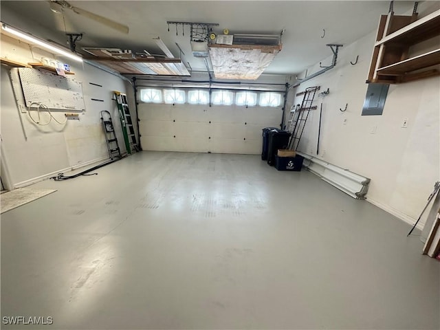 garage featuring a garage door opener, electric panel, and baseboards