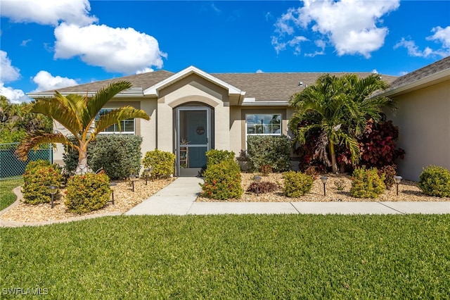 ranch-style house with a front yard