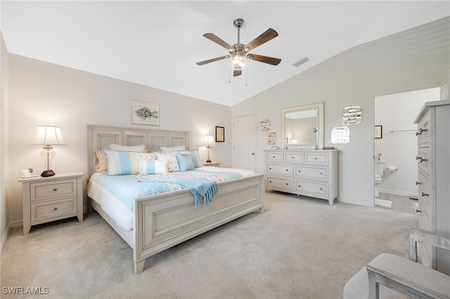 carpeted bedroom with lofted ceiling, connected bathroom, and ceiling fan