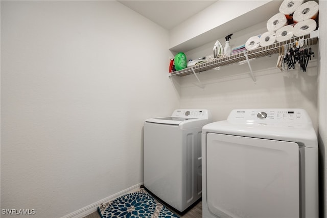 laundry area with washing machine and dryer