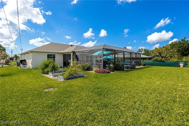 back of property featuring a yard and a lanai