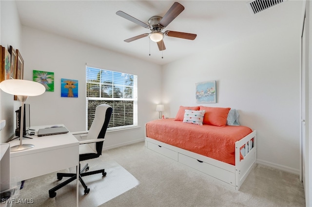 bedroom with light carpet and ceiling fan