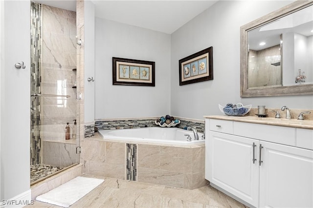 full bath featuring a stall shower, a garden tub, and vanity