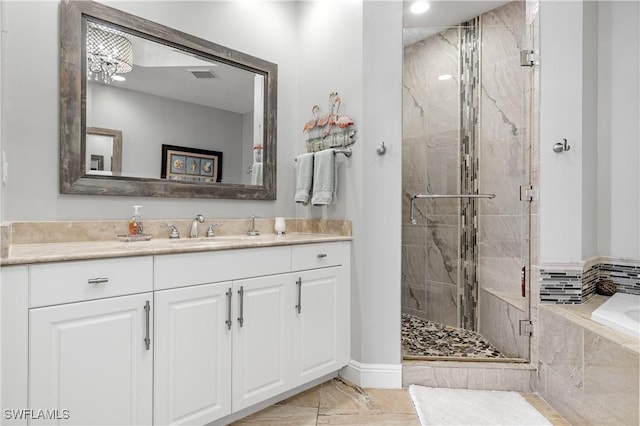 full bathroom with a stall shower, visible vents, vanity, and a bath