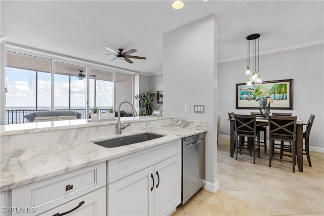 kitchen with decorative light fixtures, stainless steel dishwasher, ornamental molding, white cabinetry, and a sink