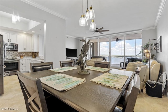 dining room featuring ornamental molding, floor to ceiling windows, light tile patterned flooring, and a ceiling fan