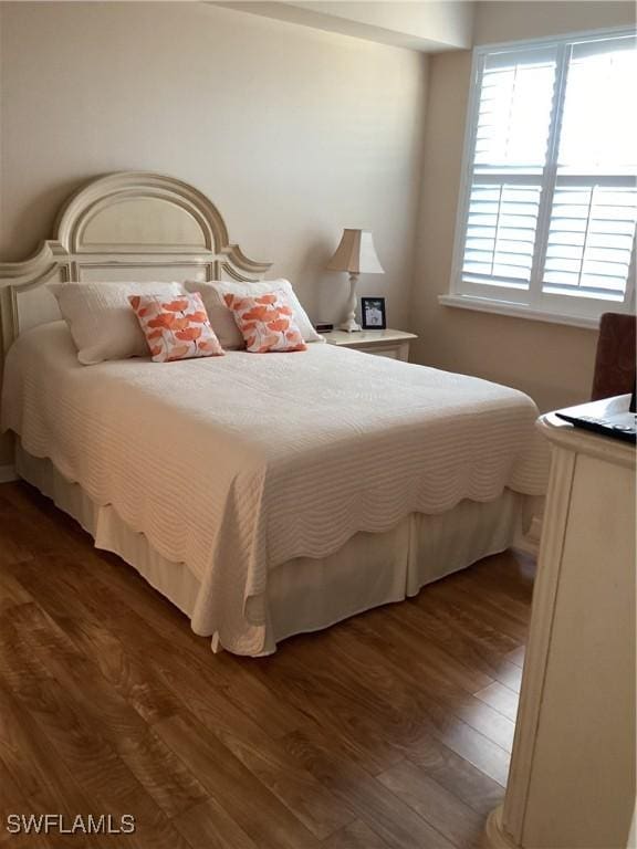 bedroom featuring dark hardwood / wood-style floors