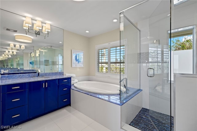 1 Sunset Captiva Ln, Captiva, FL 33924 - full bathroom featuring a shower stall, a garden tub, vanity, and tile patterned floors