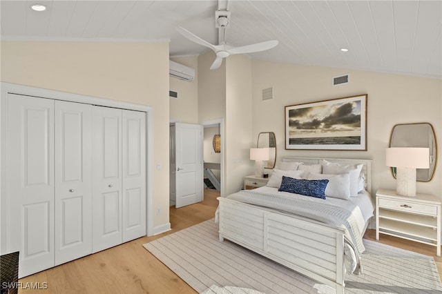 1 Sunset Captiva Ln, Captiva, FL 33924 - bedroom featuring light wood-style floors, vaulted ceiling, a closet, a wall unit AC, and recessed lighting