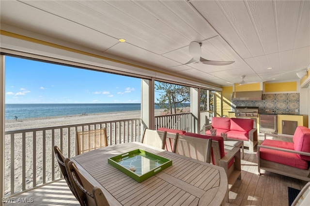 1 Sunset Captiva Ln, Captiva, FL 33924 - sunroom featuring view of water and beach