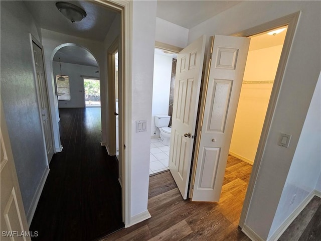 hall with dark wood-type flooring