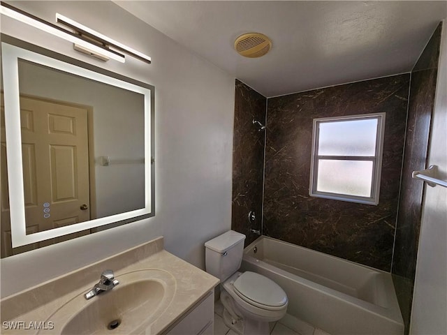 full bathroom with tiled shower / bath, vanity, and toilet