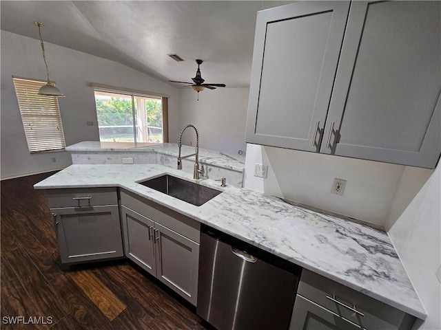 kitchen featuring light stone counters, gray cabinets, dishwasher, and sink