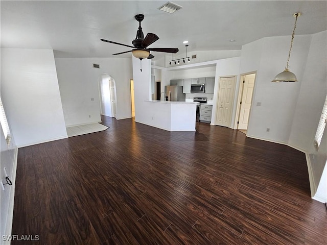 unfurnished living room with dark hardwood / wood-style floors and ceiling fan