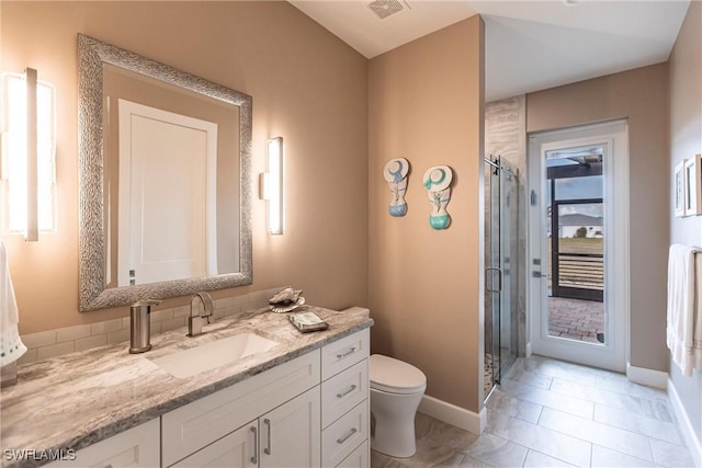 17122 Barcrest Ln, Punta Gorda, FL 33955 - bathroom with a stall shower, baseboards, vanity, and toilet