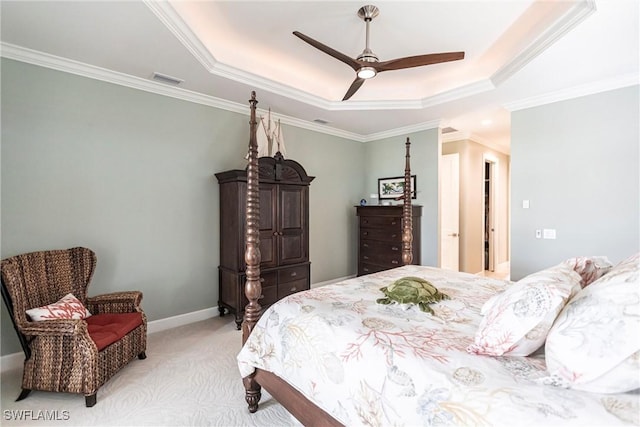 17122 Barcrest Ln, Punta Gorda, FL 33955 - bedroom featuring a tray ceiling, ornamental molding, a ceiling fan, light carpet, and baseboards