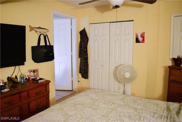 bedroom with a ceiling fan and a closet