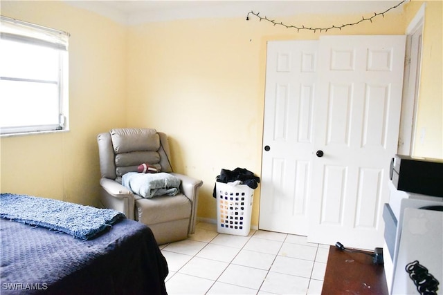 bedroom featuring light tile patterned flooring