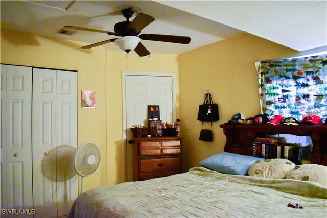 bedroom with ceiling fan, a closet, and visible vents