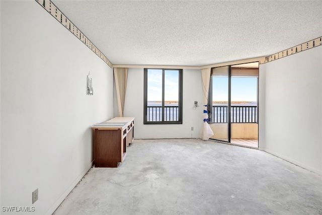 empty room featuring a textured ceiling