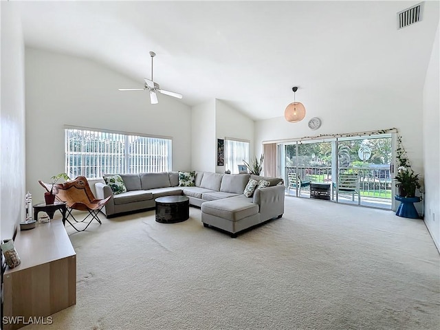 living room featuring ceiling fan, high vaulted ceiling, and carpet flooring