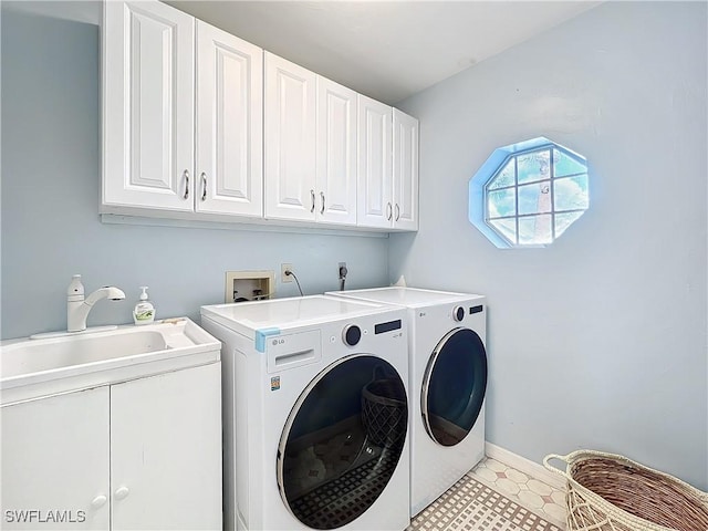 washroom with cabinets and separate washer and dryer