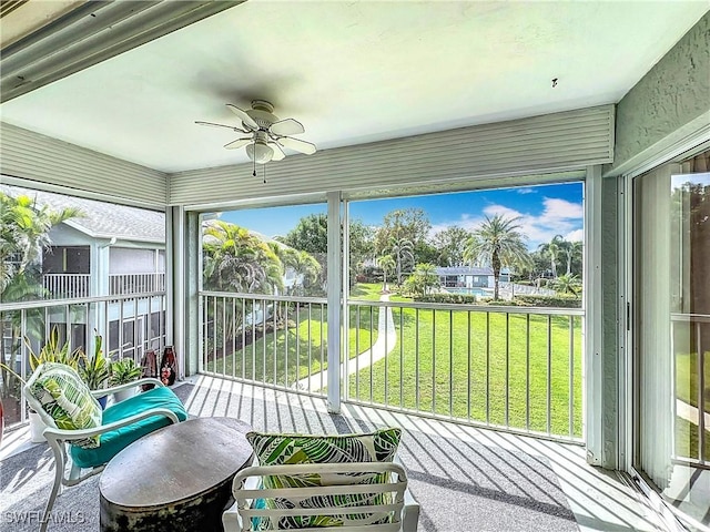 sunroom / solarium with ceiling fan