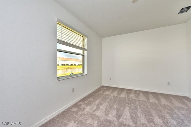 2591 Vine Ave, Naples, FL 34120 - view of carpeted spare room