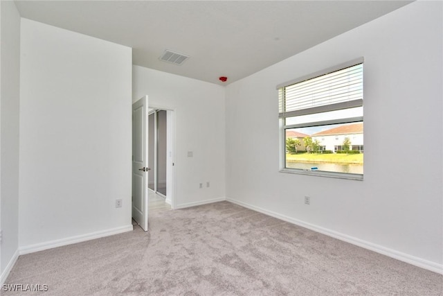 2591 Vine Ave, Naples, FL 34120 - unfurnished room with light colored carpet