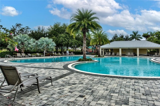 2591 Vine Ave, Naples, FL 34120 - view of pool featuring a patio area