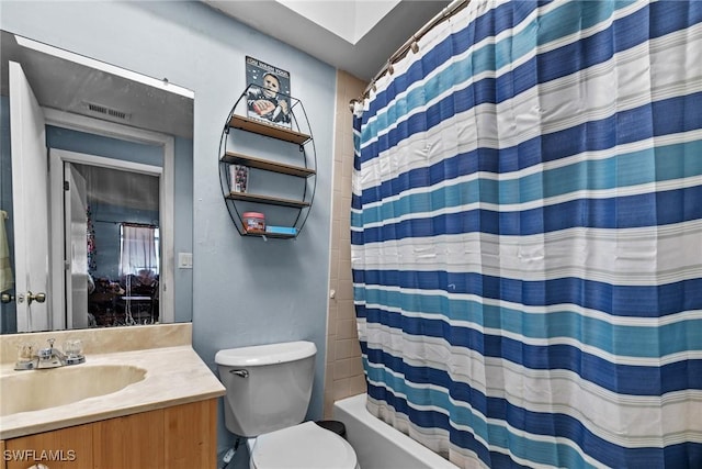 bathroom with shower / bathtub combination with curtain, vanity, and toilet