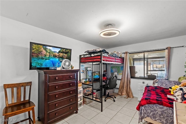 bedroom with light tile patterned floors